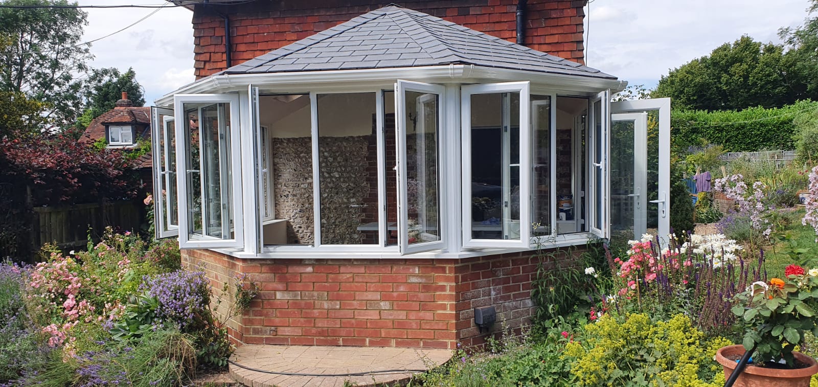 Conservatory Upgrade in Petersfield with PVCu Windows & Doors; and a Tiled Ultraframe Ultra Roof